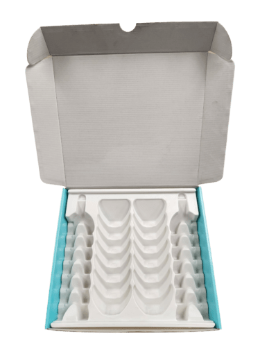 Corrugated box with thermoform insert cavities